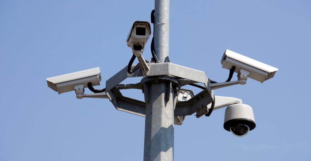 A smart surveillance camera using machine learning for real-time threat detection in a building.