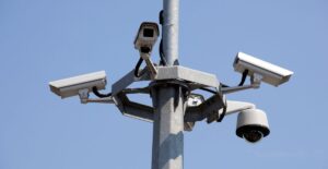 A smart surveillance camera using machine learning for real-time threat detection in a building.
